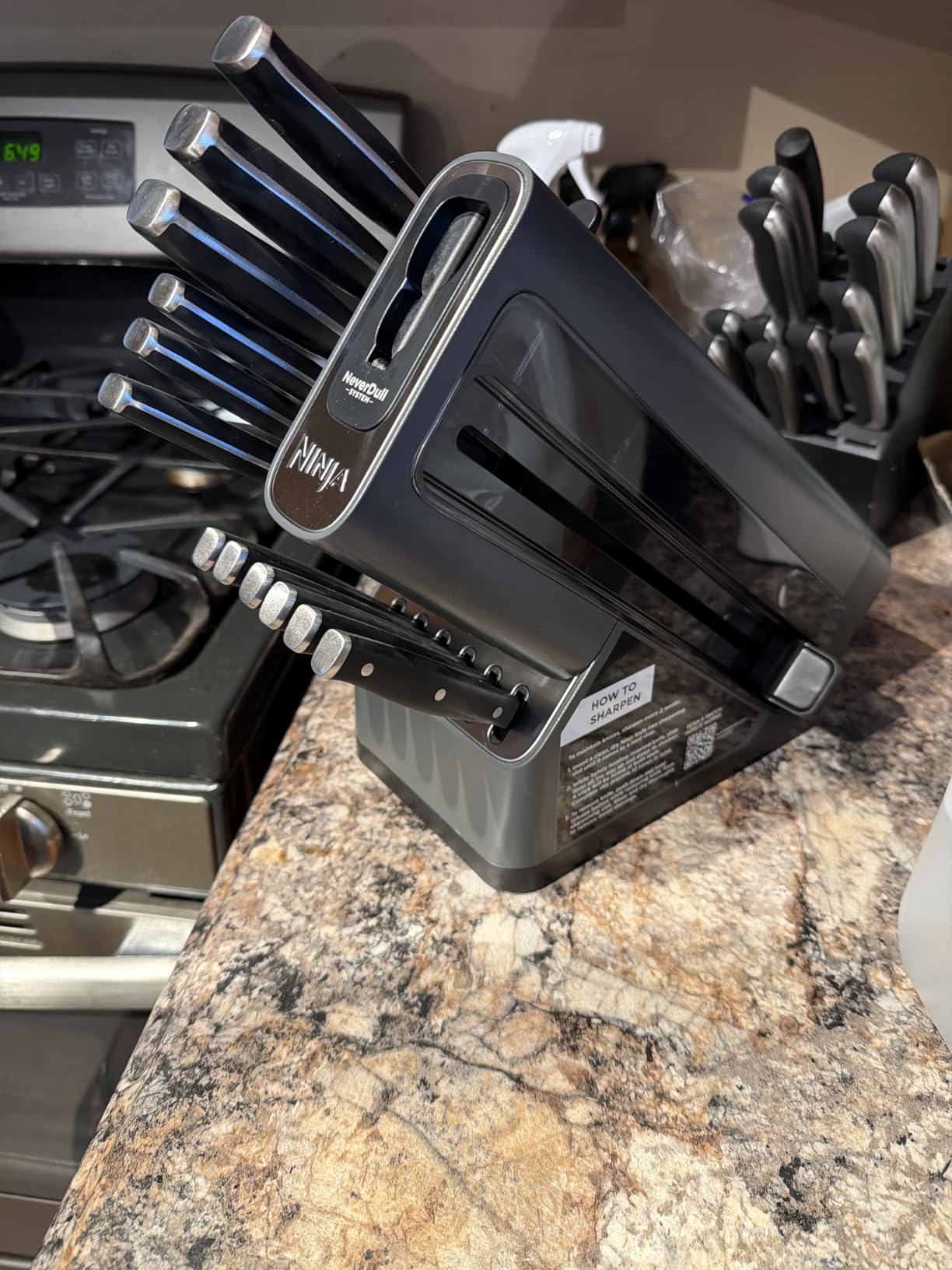 Ninja NeverDull 14-Pc Knife System, Built-in Sharpener, Black, K32014 | Stays razor-sharp 10+ years. German stainless steel blades. A few swipes of the foolproof sharpener restores a superior edge. customer photo 1