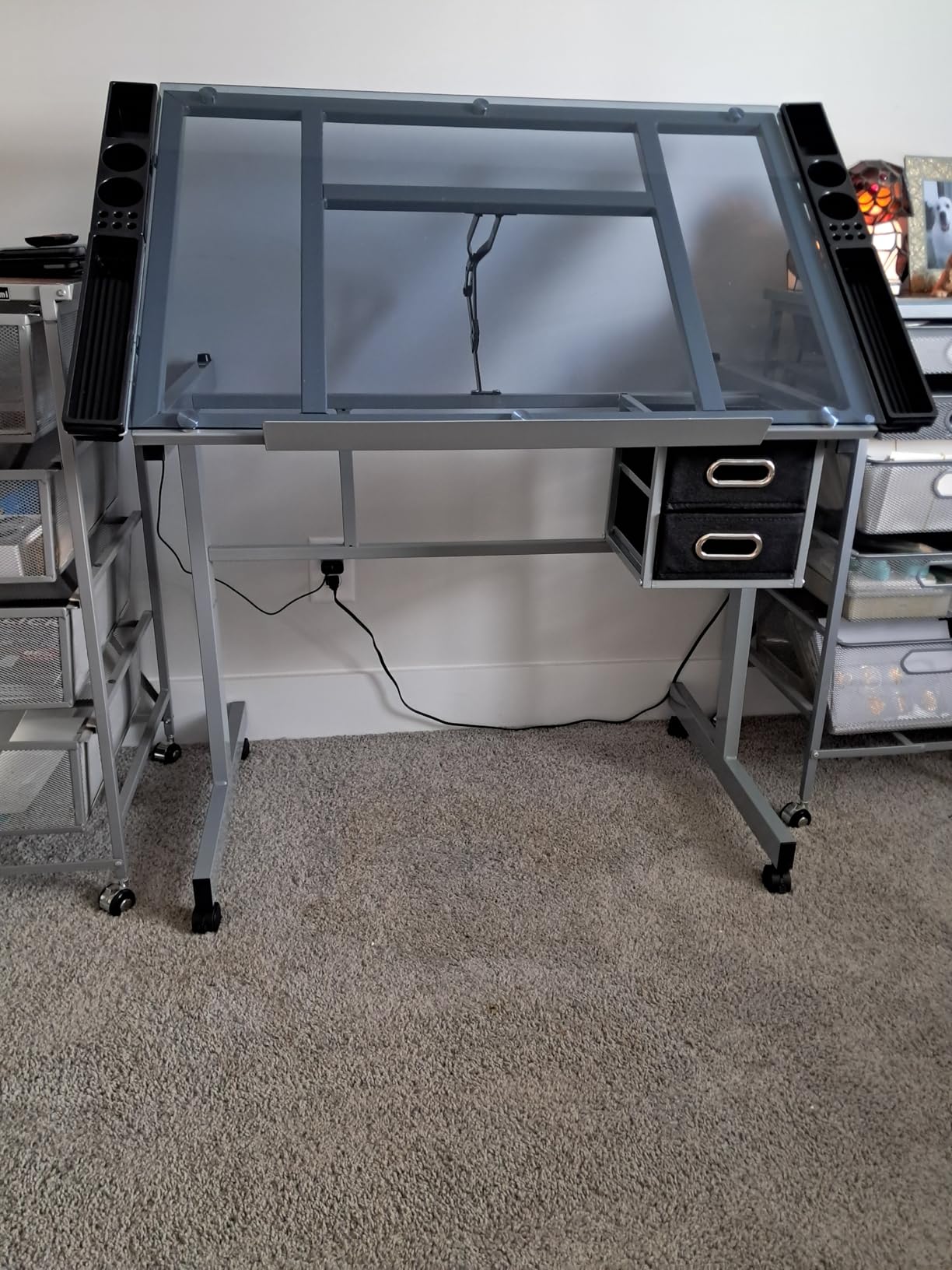 Yaheetech Glass Drafting Table with Storage, Adjustable Art Drawing Desk | Tempered glass top on a steel frame tilts 0-60° for drawing, tracing, or diamond art, plus two fabric drawers and side trays. customer photo 1