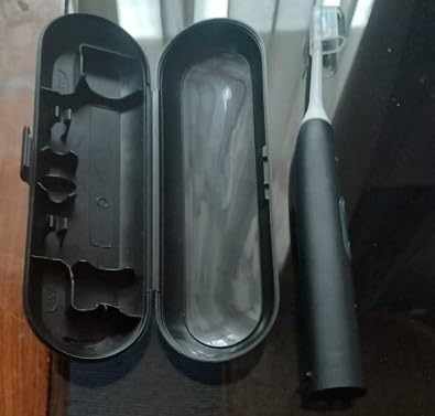 Philips Sonicare ProtectiveClean 5300 Rechargeable Electric Toothbrush, with Pressure Sensor, 3 Cleaning Modes, SmarTimer and QuadPacer, with 2 Bonus Brush Heads, Travel Case, Black, Model HX6423/34 customer photo 1