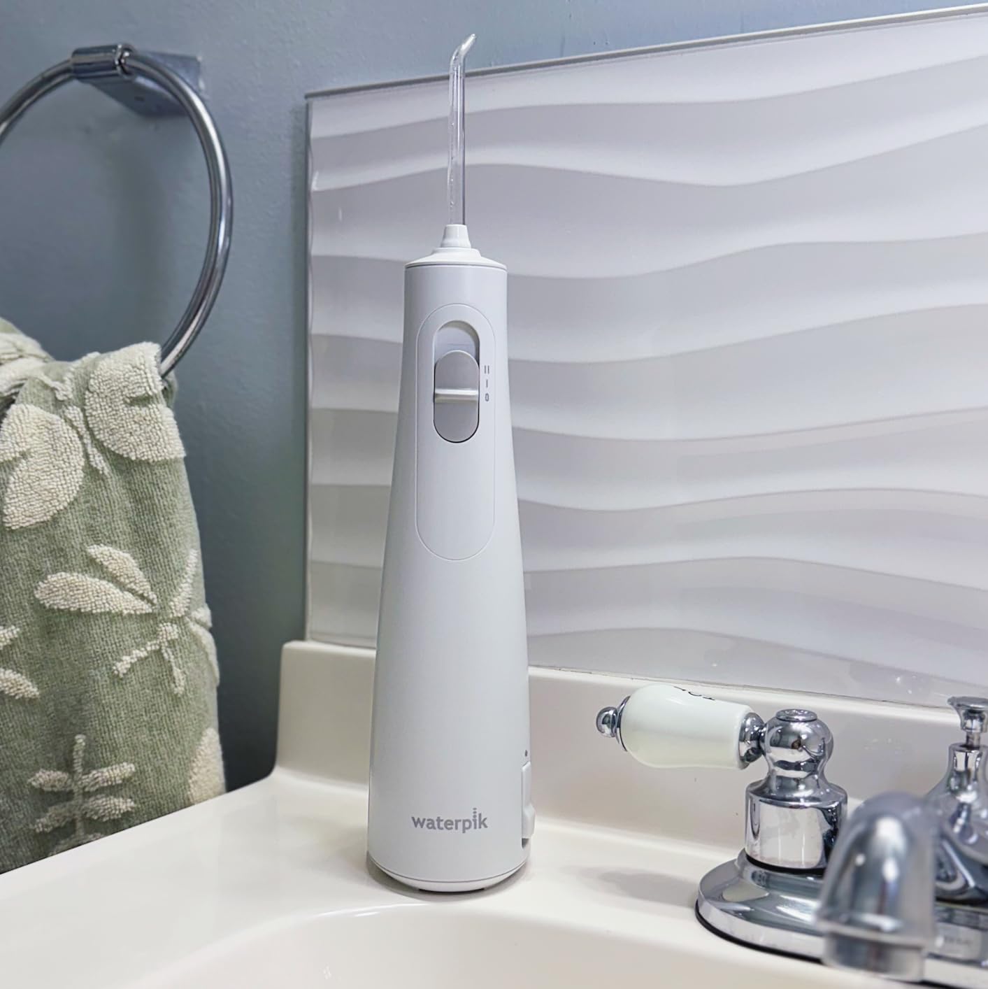 Waterpik Cordless 1100 Rechargeable Portable Water Flosser for Teeth Cleaning and Flossing, Travel, Braces Care, Healthier Gums, Waterproof for Shower, ADA Accepted, WF-30CD White, Packaging May Vary customer photo 1