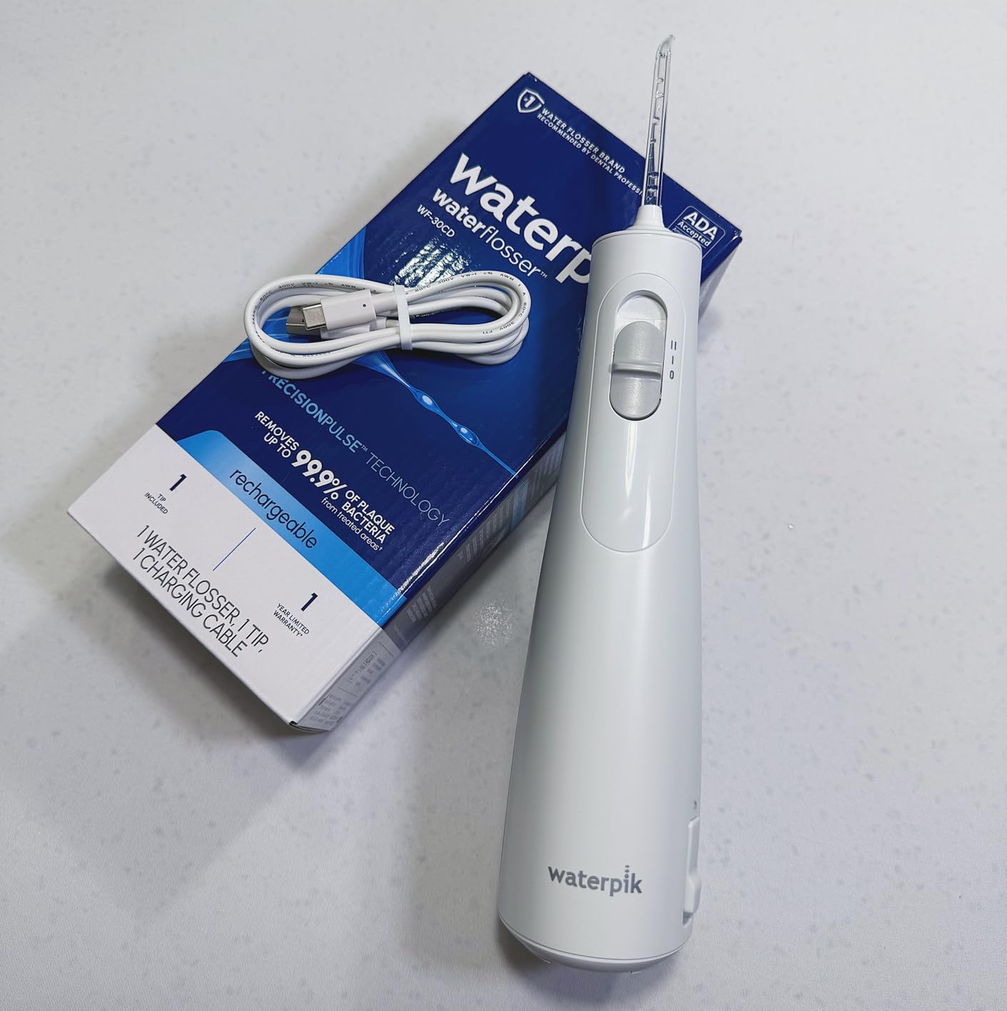 Waterpik Cordless 1100 Rechargeable Portable Water Flosser for Teeth Cleaning and Flossing, Travel, Braces Care, Healthier Gums, Waterproof for Shower, ADA Accepted, WF-30CD White, Packaging May Vary customer photo 2
