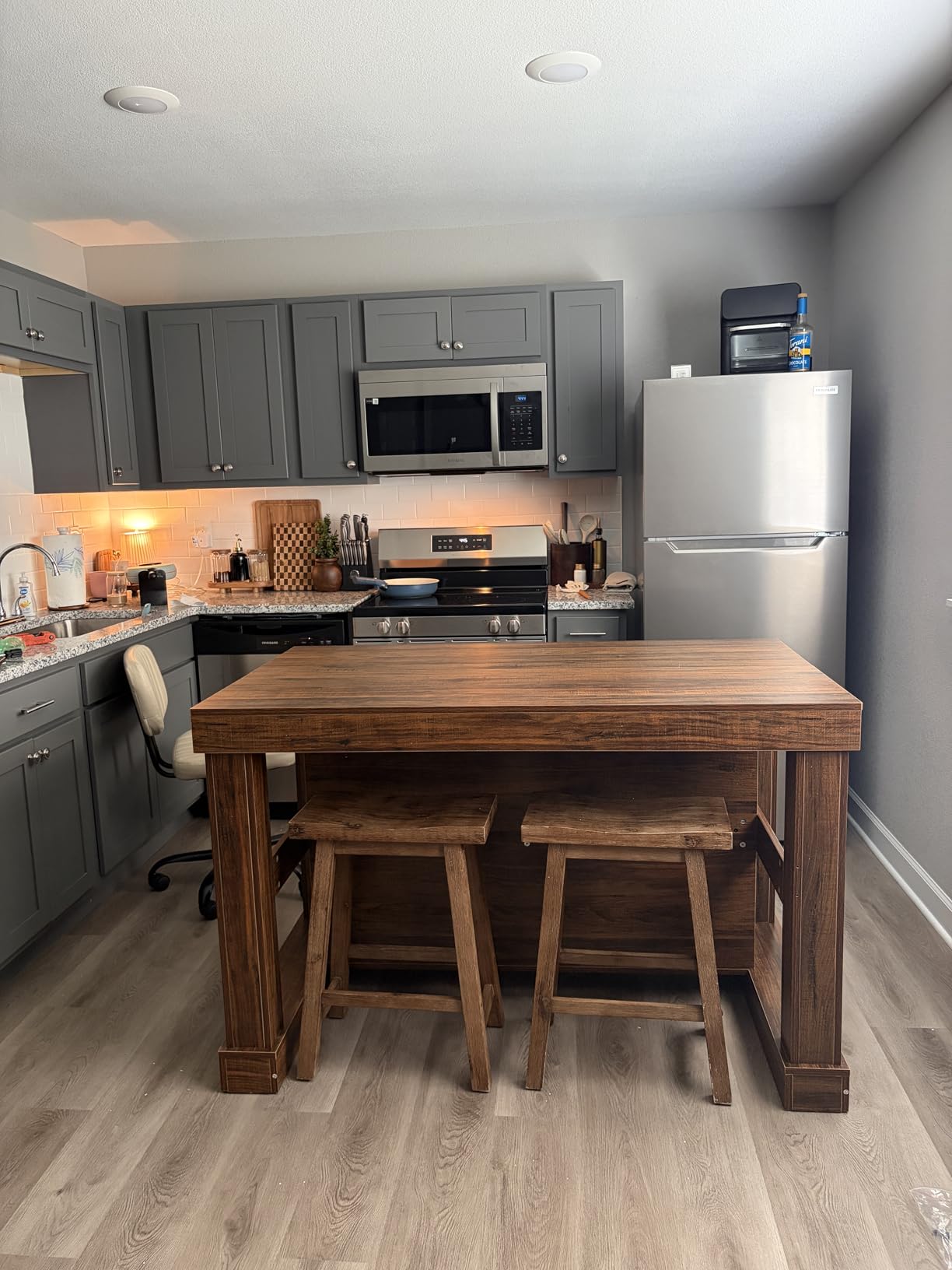 Tribesigns 55 inch Kitchen Island with Seating and Storage, 3-Tier, Modern, Wood Stationary Island Table with Large Worktop and Legroom, Heavy Duty, Coffee Bar Table with Storage Shelf for Kitchen, White customer photo 2